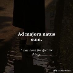 a person standing in the water with their feet in the water and an ad that says, ad majorora nattus sum i was born for greater things