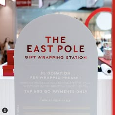 the east pole gift wrapping station is located in an indoor mall, where customers are able to purchase their own products