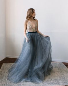 This a fancy tulle wedding skirt with a long train, elegant and airy. The skirt consists of several layers of silk, chiffon, and tulle. It is fastened on the back with a concealed zipper and velvet belt. If you want to change any detail in the style of the wedding skirt, just email us. We will discuss everything and make a custom skirt for you. All our skirt are made to order. Rush orders: Please contact us if your situation requires shorter production times; we will do our best to help you. Siz Dark Blue Wedding Dress, Wedding Skirt Top, Silk Bridal Gown, Bridal Bow, Dark Blue Wedding, Tulle Wedding Skirt, Floral Evening Dresses, Tule Rok, Cape Wedding Dress