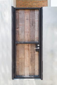 an open wooden door on the side of a building