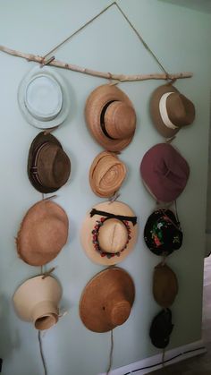 many hats are hanging on the wall