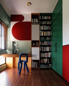 a room with bookshelves and a chair in it