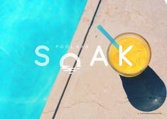 an orange drink sitting on top of a swimming pool next to a blue water filled pool