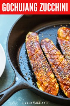 three pieces of fish cooking in a skillet with the words gochuang zucchini on it