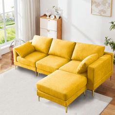 a living room with a yellow couch and ottoman in the corner, next to a white rug