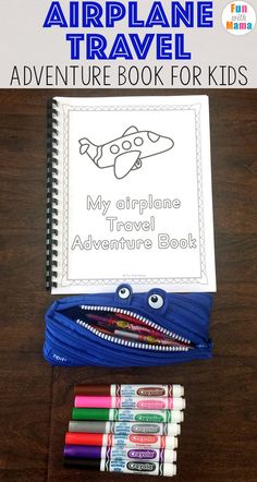 an airplane travel book for kids with markers and crayons on the table next to it