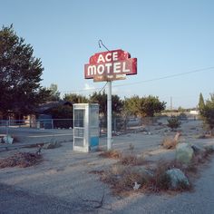 an old motel sign in the middle of nowhere