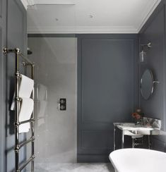 a bathroom with gray walls and white fixtures