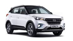 the front end of a white car on a white background with an inscription that reads creta