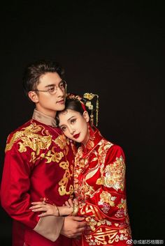 a man and woman in traditional chinese clothing