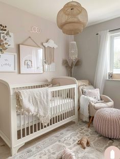 a baby's room with pink and white decor