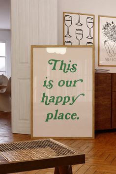 this is our happy place sign in front of a table with wine glasses on it