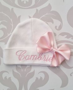 "100% cotton, Personalized, embroidered cap. Includes one name embroidered in light pink and satin bow. Other colors and fonts can be used upon request. Makes a great baby shower gift. If you need a rush order or have a special request or question, please message me through Etsy. Please be sure to include name info in the \"notes to seller\" box that can be found once an item is added to your cart. Caps and headbands are one size and stretch greatly to accommodate many shapes and sizes. Please a Pregnancy Gender, Baby Girl Hat, Silhouette School, Embroidered Cap, Embroidered Name, Hand Knit Hat, Baby Organization