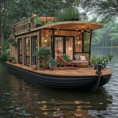 a houseboat is floating in the water with plants on it's deck and windows