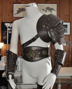 a white mannequin with leather armor on it's back and shoulder straps