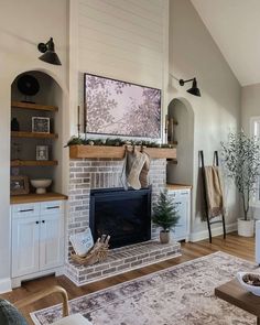 a living room filled with furniture and a fire place in the middle of a room