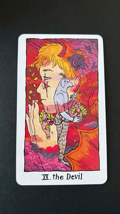 a tarot card with an image of a woman holding flowers and the words x, the devil