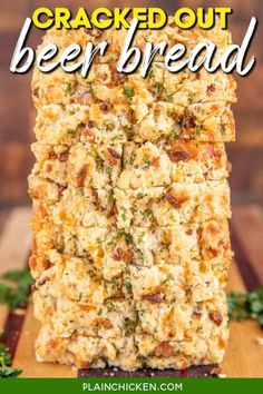 a stack of cracked out beer bread sitting on top of a wooden cutting board