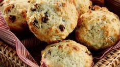 a basket filled with muffins sitting on top of a table