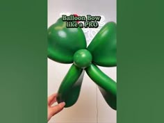 the balloon bow like a pro is being held up