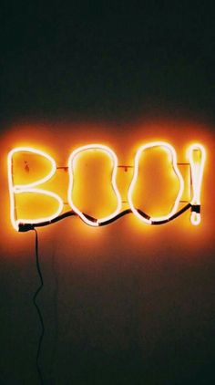 a neon sign that says boo on it