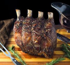 a large piece of meat sitting on top of a wooden cutting board