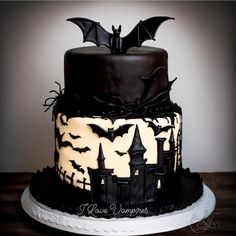 a black and white cake with bats on it