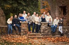 a large group of people are posing for a family photo