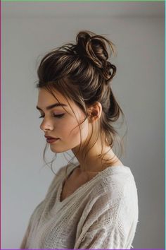 A high bun secured with a scrunchie serves as a quick and stylish solution for busy mornings, blending convenience with fashion. Click to see more. Grunge Haircuts, Vivid Hair Color Ideas, Hair Straightening Tips, Festival Hair Trends, Dr Hairstyles, Victorian Hair Jewelry, Messy Bun For Short Hair, Simple Braids, Quick Updos