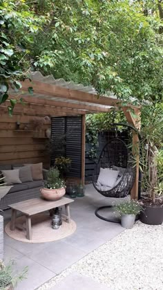 an outdoor living area with furniture and plants