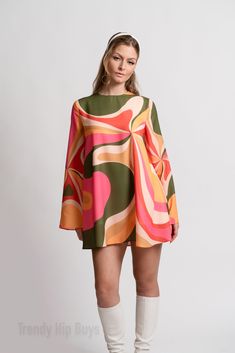 Step into the enchanting world of 70s Dress Style with our Bell Sleeve Dress, a captivating piece that encapsulates the spirit of the groovy era. This 60s 70s mini dress is a Boho Dress with a distinctive Bohemian touch, perfect for those seeking a Hippie Dress that exudes both charm and style.The Multicolor Tent Dress features a groovy pattern print inspired by the psychedelic aesthetics of the 70s, creating a visually striking and unique look. This slip-on dress is designed for ease and comfort, complemented by bell sleeves that add a touch of vintage flair. The single button enclosure behind the neckline enhances the Bohemian feel of the dress.Crafted from chiffon and fully lined material, this Groovy 70s Style Dress ensures a luxurious feel and graceful movement. The 100% polyester con Modern Groovy Outfit, Spring Long Sleeve Hippie Mini Dress, Hippie Long Sleeve Mini Dress For Spring, Spring Hippie Long Sleeve Mini Dress, Retro Multicolor A-line Dress, Bohemian A-line Mini Dress For Party, Vintage Green Long Sleeve Mini Dress, Retro Dress With Orange Retro Print, Orange Retro Dress With Retro Print