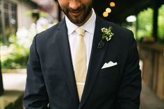 Pale yellow tie and a simple green boutonniere for this groom Yellow Tie Groomsmen, Black Suit Yellow Tie, Yellow Boutonniere, Black Tux Wedding, Green Boutonniere, Wedding Palettes, Different Wedding Ideas, Prom For Guys, Prom Suits For Men