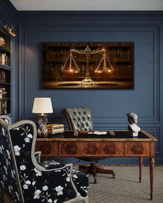 a room with a desk, chair and bookcase in front of a painting on the wall