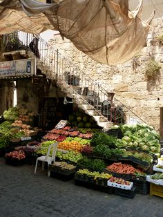 an open air market with lots of fresh fruits and vegetables