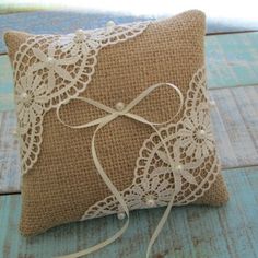 a decorative pillow with a bow on it