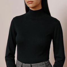 This long sleeved turtle neck jumper is super soft and light weight. Featuring a deep rib neck and cuffs. In classic black colour it is a timeless winter essential. Perfect for layering or wearing simply on its own. 53% Cotton 42% Viscose 5% Silk Black Polo Neck Outfit Woman, Turtle Neck Jumper, Wardrobe Edit, Pregnancy Stages, Black Polo, Fabric Suppliers, Winter Essentials, Black Colour, Short Tops