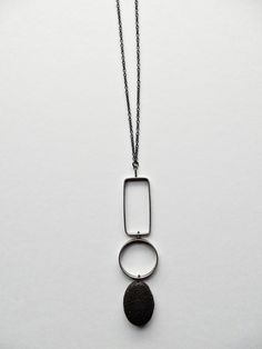 Silver & Stone Necklace - An oval of lava rock is situated beneath cast and fabricated oxidized sterling silver textured shapes.<br><br>Sterling silver chain long enough to slip over the head with no clasp. Wire Wrap Cabochon, Onyx Necklace, Artful Home, Wire Work Jewelry, Work Jewelry, Lava Rock, Geometric Necklace, Oxidized Sterling Silver, Art Jewelry