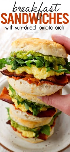 the sandwich has bacon, lettuce and eggs on it with avocado