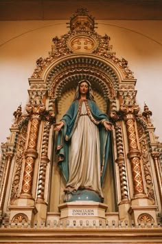 a statue of the virgin mary on display in a church