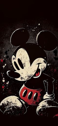 a mickey mouse painting on the side of a black wall with paint splattered over it