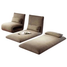 three pieces of furniture with pillows on the floor and one piece sitting on top of it