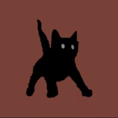 a black cat is standing on its hind legs and it's eyes are glowing