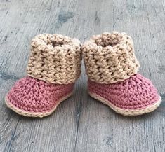 crocheted baby booties with pink and beige colors