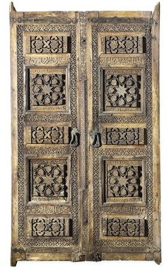 an old wooden door with intricate carvings on the front and side panels, isolated against a white background