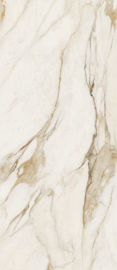 a white marble textured surface with gold accents