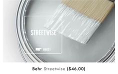 a paint can with a brush in it and the words behr streetwise $ 16 00