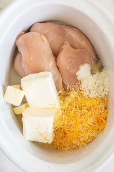 chicken, cheese and other ingredients in a white bowl