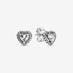 Is there a more romantic way to express your love and appreciation than to give your loved one a set of heart-shaped stud earrings? These timeless and dreamy sterling silver earrings feature an elevated cubic zirconia setting for extra brilliance and sparkle. The sparkling ear studs are a classic style that will be treasured for years to come thanks to its sophisticated, yet simple design. Wear alone or together with the matching necklace for a co-ordinated and elegant look. - Pandora Elevated H Silver Pandora Earrings, Pandora Heart Earrings Silver, Stud Earrings Heart, Pandora Heart Earrings, Pandora Earrings Studs, Pandora Earrings, Pandora Heart, Heart Stud Earrings, Heart Studs