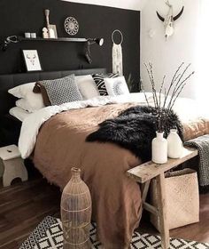 a black and white bedroom with a large bed