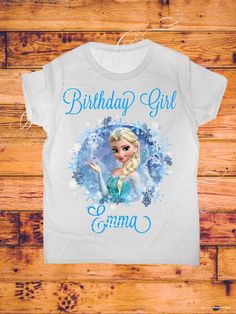 a frozen princess birthday shirt with the words,'birthday girl'in blue on it